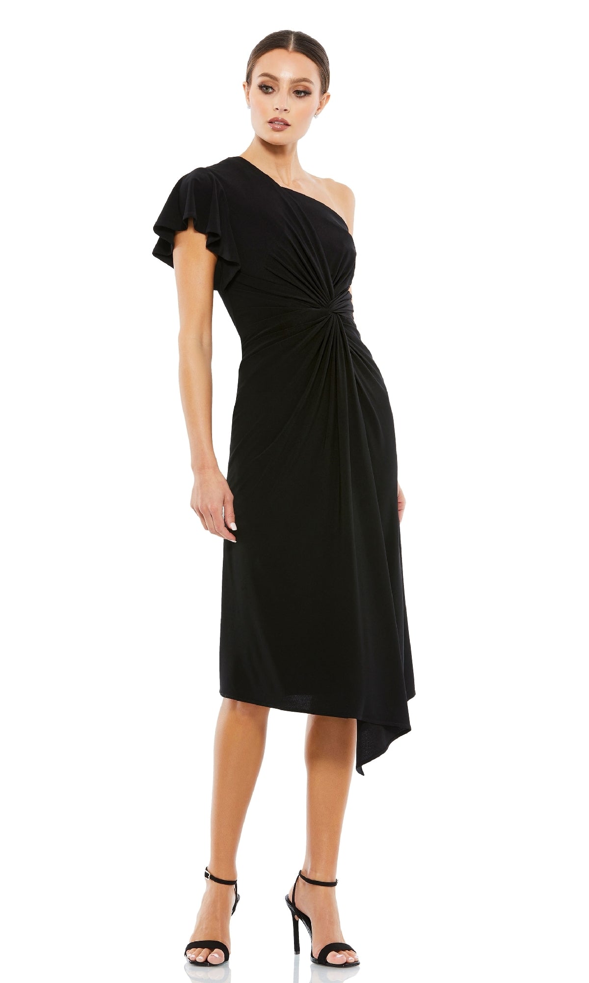 Woman wearing the One-Shoulder Knot-Waist Midi Party Dress 12480 in black, featuring a gathered waist and asymmetrical hem, styled with black heels against a white background—a chic cocktail party look.